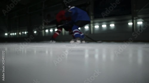 Wallpaper Mural The confrontation between the two players on the ice field, the power to receive and drop the player in a red shirt Torontodigital.ca