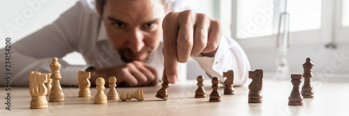 Businessman brainstorming as he creates business strategy photo