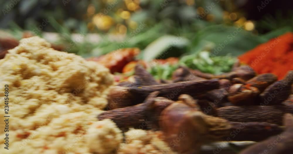 Special slide shot of varius spices in spoons on a wooden bench, the camera slides into them really close. Special slide shot of varius spices in spoons on a wooden bench, the camera slides into them really close.