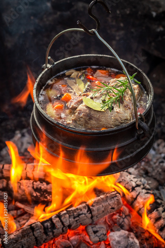 Hot and yummy hunter's stew with vegetables and herbs
