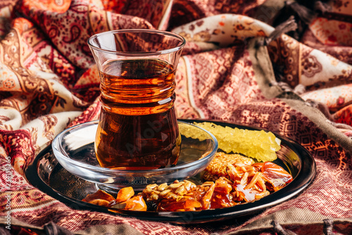 Tea in armudu with oriental delights and crystal sugar photo