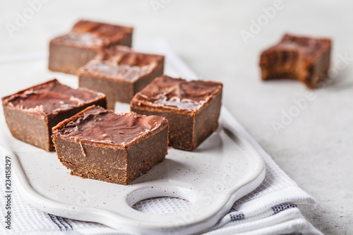 Raw Vegan Chocolate Cake Slices on white background.