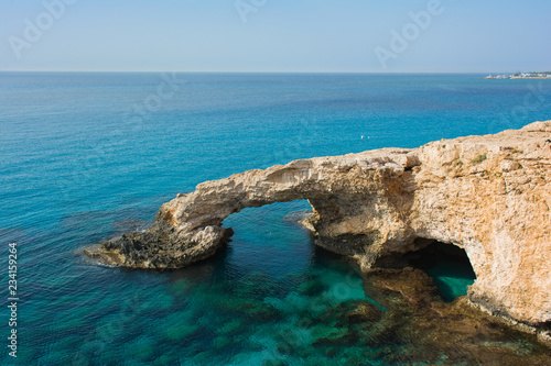 Bridge of Lovers - beautiful natural arch - on the background of blue sky. Agia Napa, Cyprus