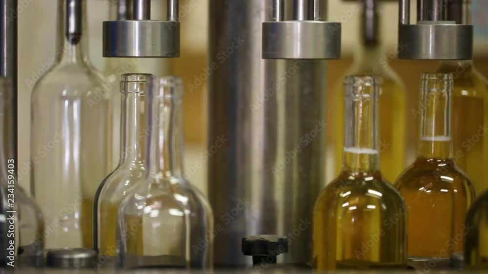 Bottling and sealing conveyor line at winery Bottling and sealing conveyor line at winery