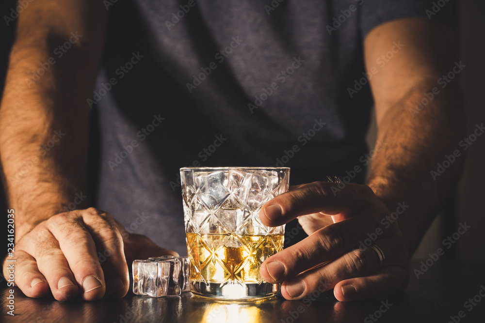 dark background whiskey ice glass ice hand photo moody pouring alcohol bourbon bartender bar hotel home