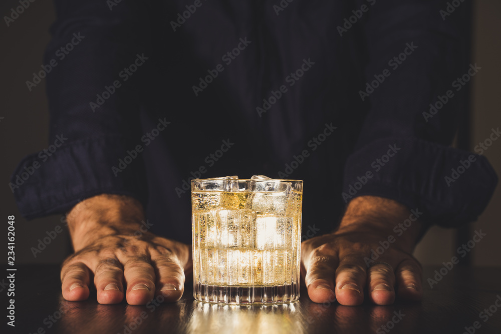 dark background whiskey ice glass ice hand photo moody pouring alcohol bourbon bartender bar hotel home