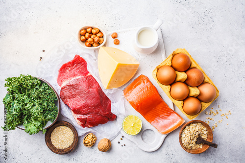 Balanced diet food background. Protein foods: fish, meat, eggs, cheese, quinoa, nuts on white background. photo