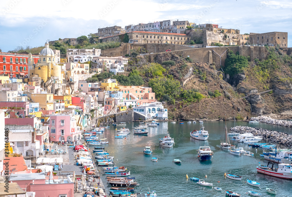 Marina Corricella, colourful fishing village on the island of Procida in the Bay of Naples, Italy. Photo taken from the top of the cliff. 
