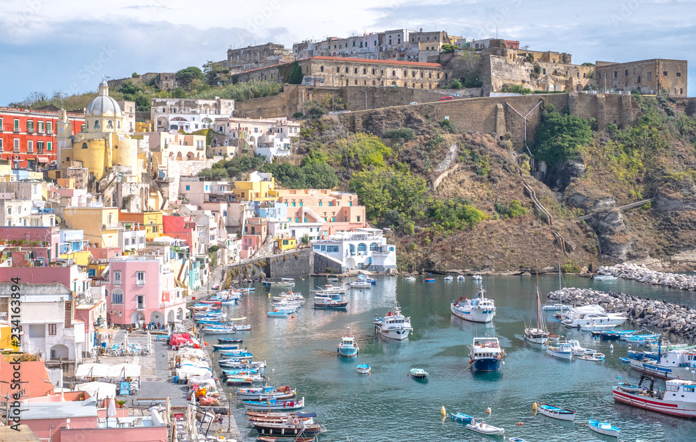 Marina Corricella, colourful fishing village on the island of Procida in the Bay of Naples, Italy. Photo taken from the top of the cliff. 