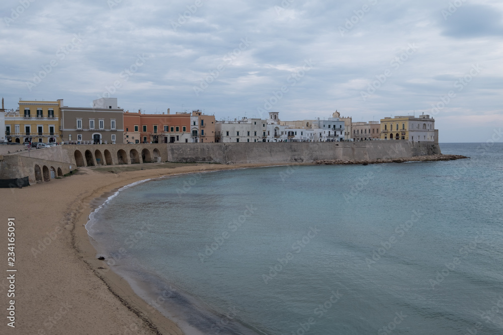 Gallipoli Italy. Wide angle photograph of the beach and coastline in the town of Gallipoli in the Salento Peninsula, Puglia, Southern Italy. 