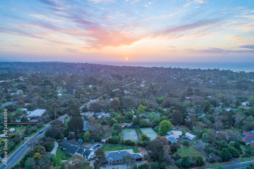 Rural area near the ocean at sunset - aerial view