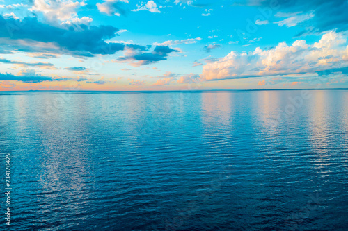 Minimal aerial seascape - clouds over ocean at sunset