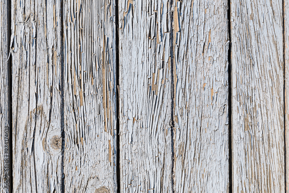 Wooden boards which are badly faded and peeling paint Wooden boards which are badly faded and peeling paint