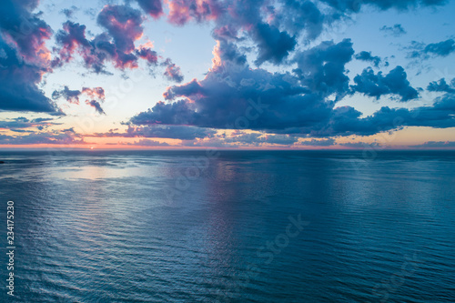 Fototapeta Naklejka Na Ścianę i Meble -  Aerial view of sunset over ocean
