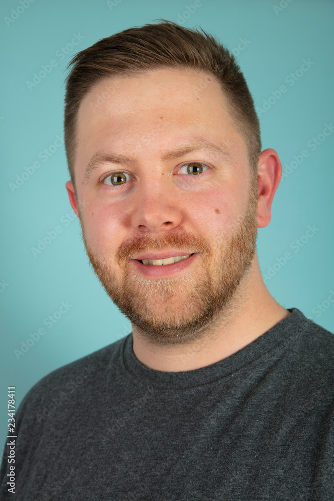 Fototapeta premium Bearded casual man looking pensively at the camera
