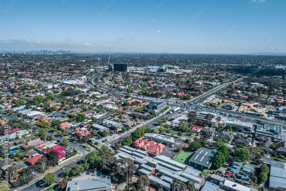 Fototapeta premium Aerial view of urban area with Melbourne CBD in the distance