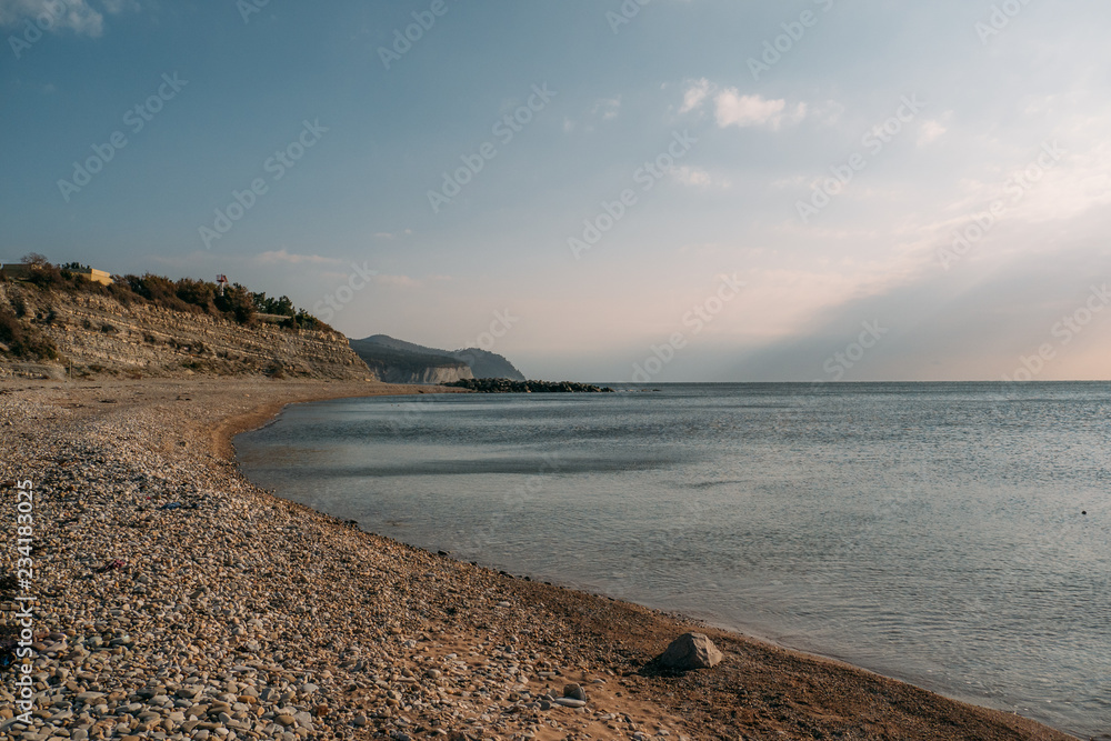 Sea mediterranean landscape, empty stone beach at sunset, copy space Sea mediterranean landscape, empty stone beach at sunset, copy space