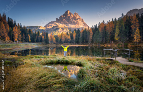 Man with raised up arms on ...