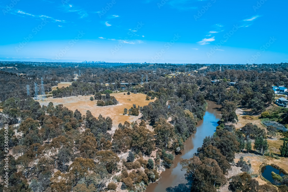 Aerial view of Yarra River flowing through Eltham suburb in Melbourne, Australia