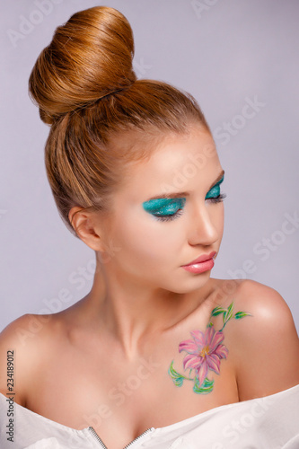 The nice girl closing eyes with the turned head in the right. Bright, spring make-up