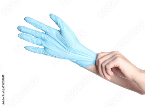 Fototapeta Naklejka Na Ścianę i Meble -  Doctor wearing medical glove on white background