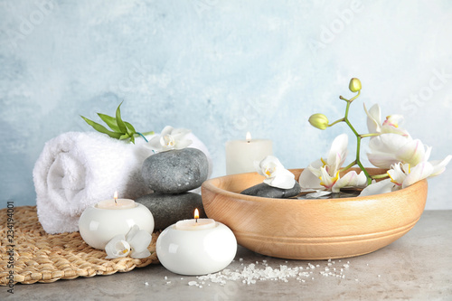 Fototapeta Naklejka Na Ścianę i Meble -  Composition with spa stones and candles on gray table