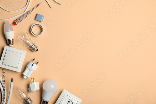 Flat lay composition with electrician's tools and space for text on color background