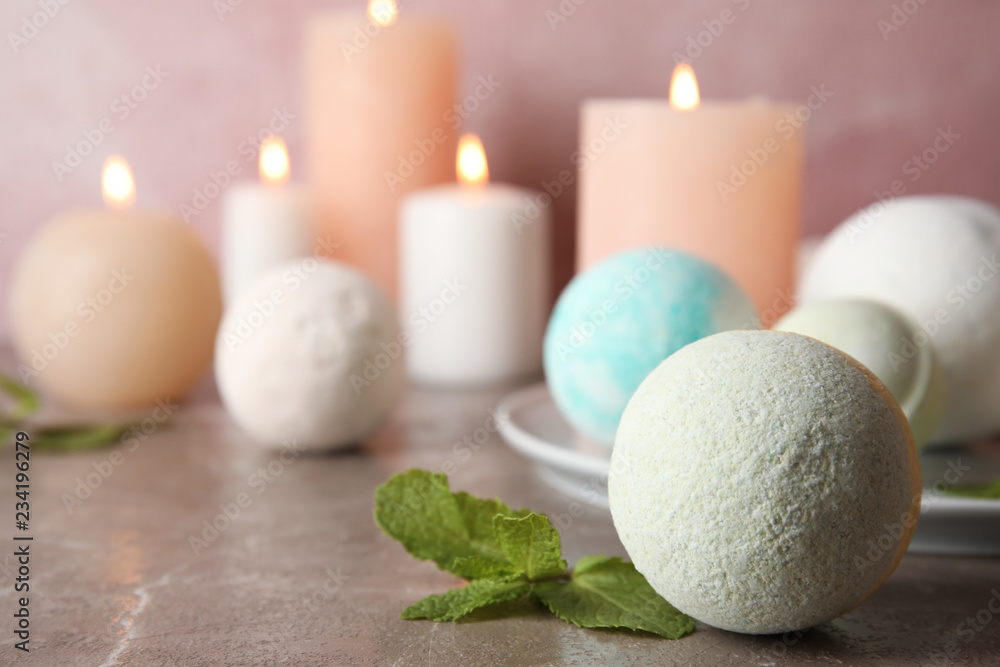 Bath bombs and mint leaves on table. Space for text