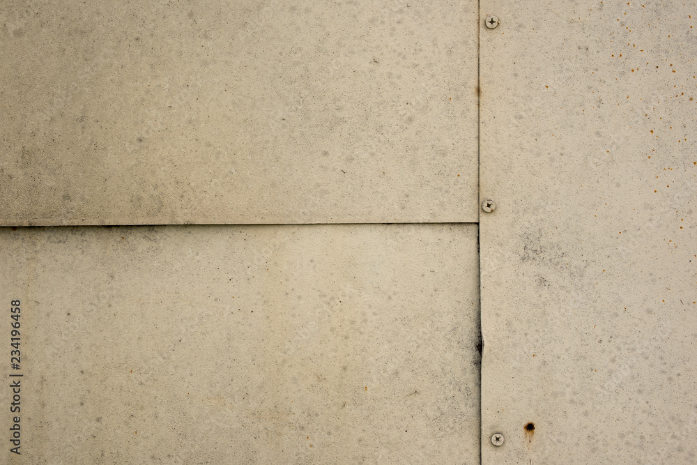 The texture of the metal plates connected by screws The texture of the metal plates connected by screws