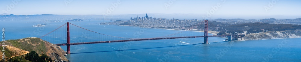 Panoramic view of Golden Gate Bridge; the San Francisco skyline visible in the background; California