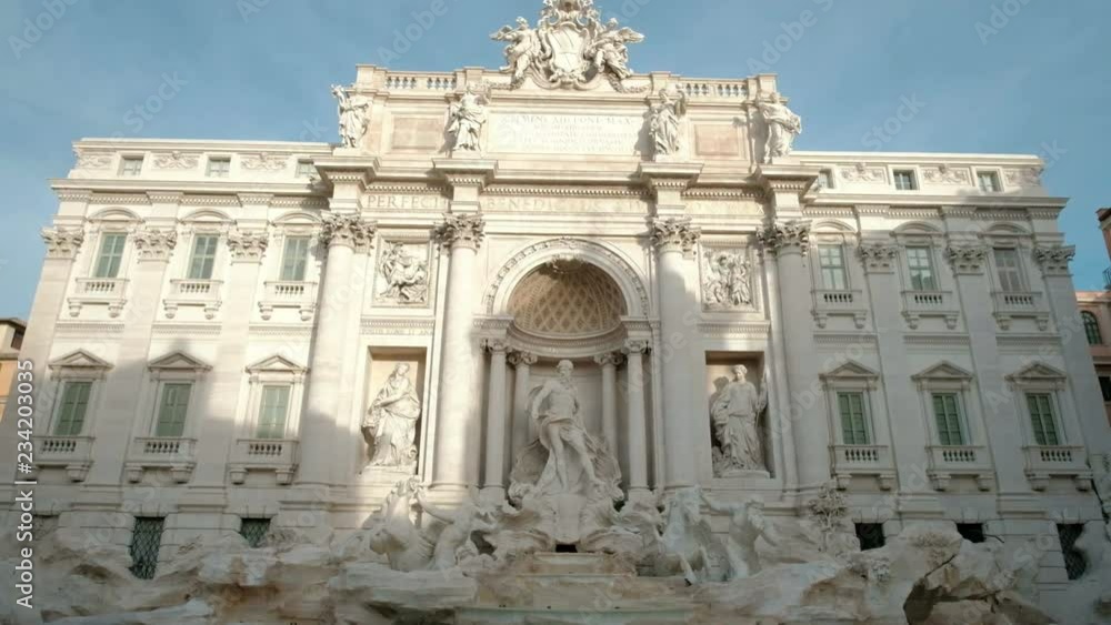 Center view of Trevi Fountain landmark in early morning panning up from water and facade statues with nobody around in Rome, Italy. 4k UHD at 29.976fps Center view of Trevi Fountain landmark in early morning panning up from water and facade statues with nobody around in Rome, Italy. 4k UHD at 29.976fps