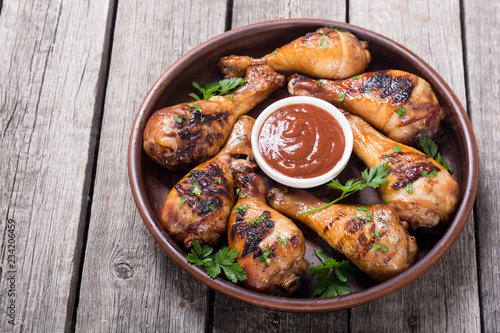Grilled chicken legs with tomato sauce BBQ food background