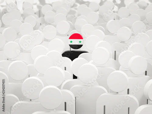 Man with flag of syria in a crowd