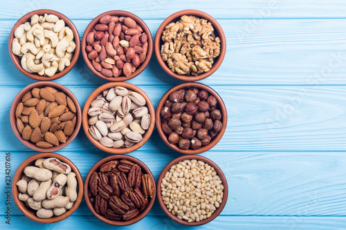 Mix of nuts : Pistachios, almonds , walnuts , pine nut , hazelnuts and cashew . Snack in bowl backgrond