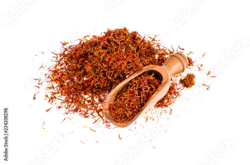 Canvas-taulu Dry spice saffron in wooden scoop isolated on white background
