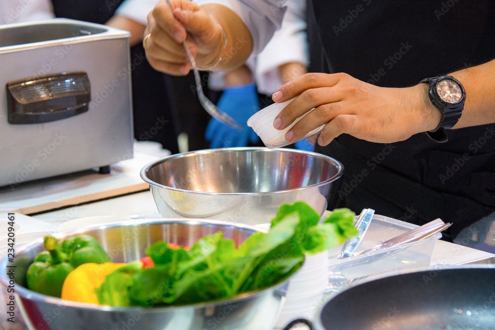 Chef preparing food, meal, in the kitchen, chef cooking, Chef decorating dish, closeup, .Chef preparing food, meal, in the kitchen, chef cooking, Chef decorating dish, closeup, .