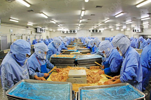 Workers in a meat processing production line, in a food processing enterprise, tangshan city, hebei province, China.