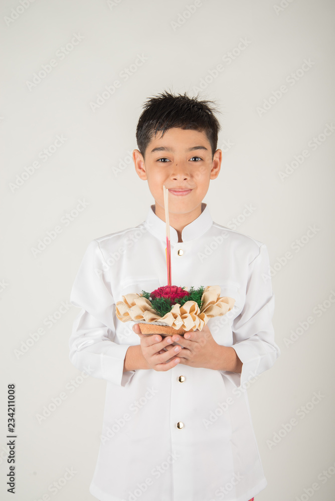 Little boy taking kratong in Loy Kratong floating festival Little boy taking kratong in Loy Kratong floating festival