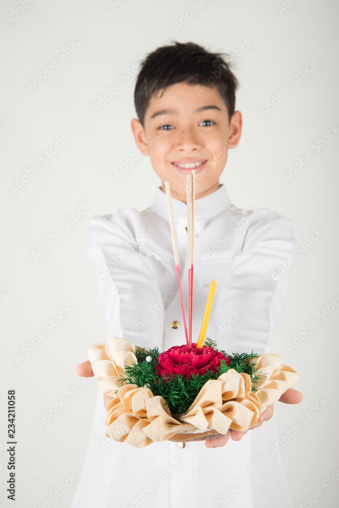 Little boy taking kratong in Loy Kratong floating festival Little boy taking kratong in Loy Kratong floating festival