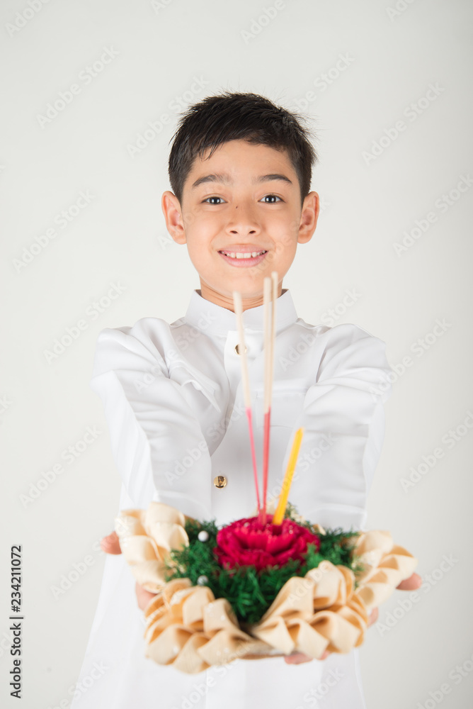 Little boy taking kratong in Loy Kratong floating festival Little boy taking kratong in Loy Kratong floating festival