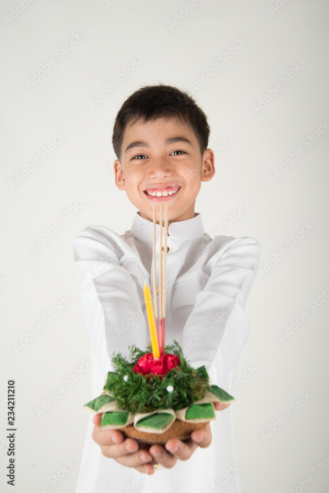 Little boy taking kratong in Loy Kratong floating festival Little boy taking kratong in Loy Kratong floating festival