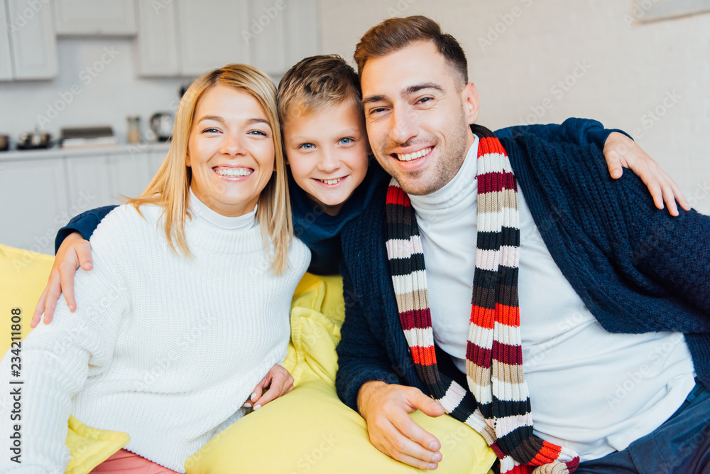 Fototapeta premium loving parents and son looking at camera