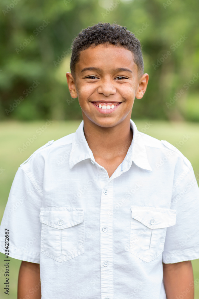 Young handsome boy laughing and smiling outside. Young handsome boy laughing and smiling outside.