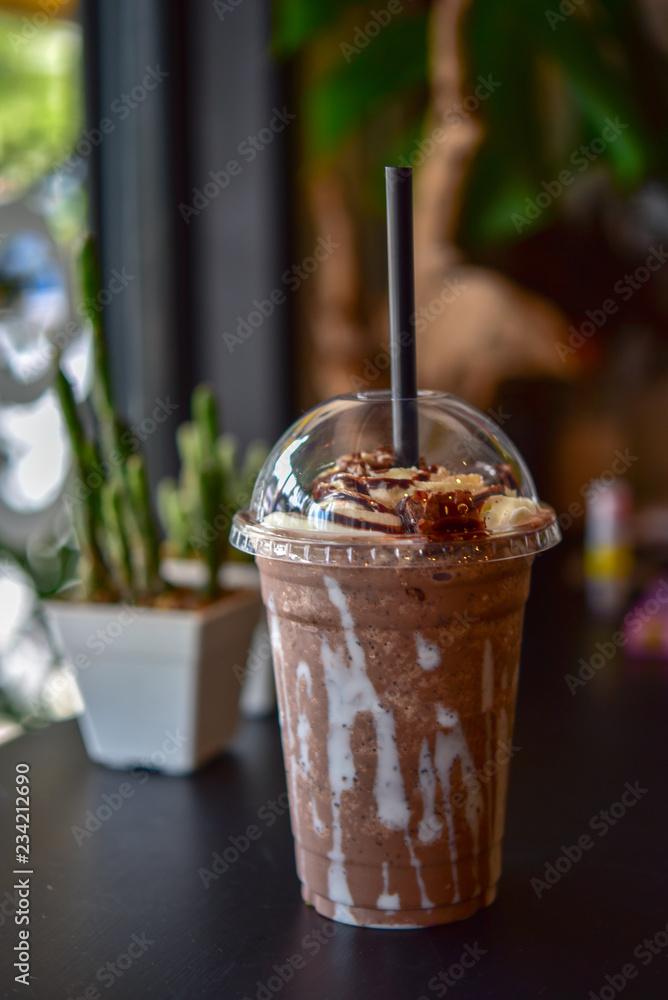 Chocolate smoothie (milkshake) with jar in cafe Photos | Adobe Stock