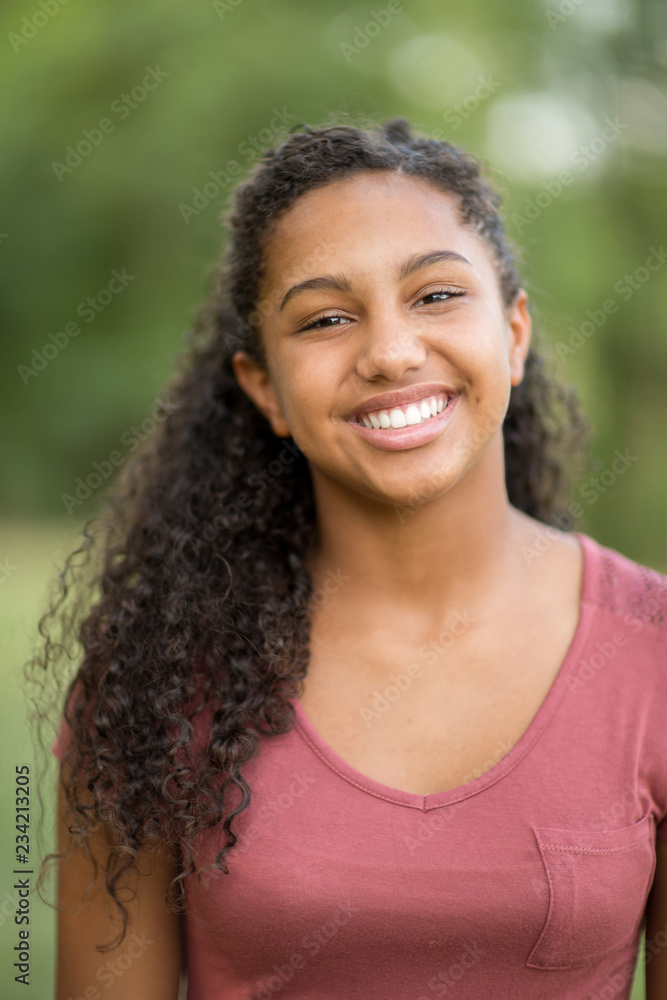 Young happy teen girl laughing and smiling.
