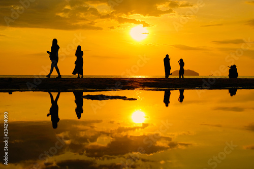 Wallpaper Mural Tourist visiting Tanjung Aru beach during sunset in Kota Kinabalu, Sabah, Malaysia. Torontodigital.ca
