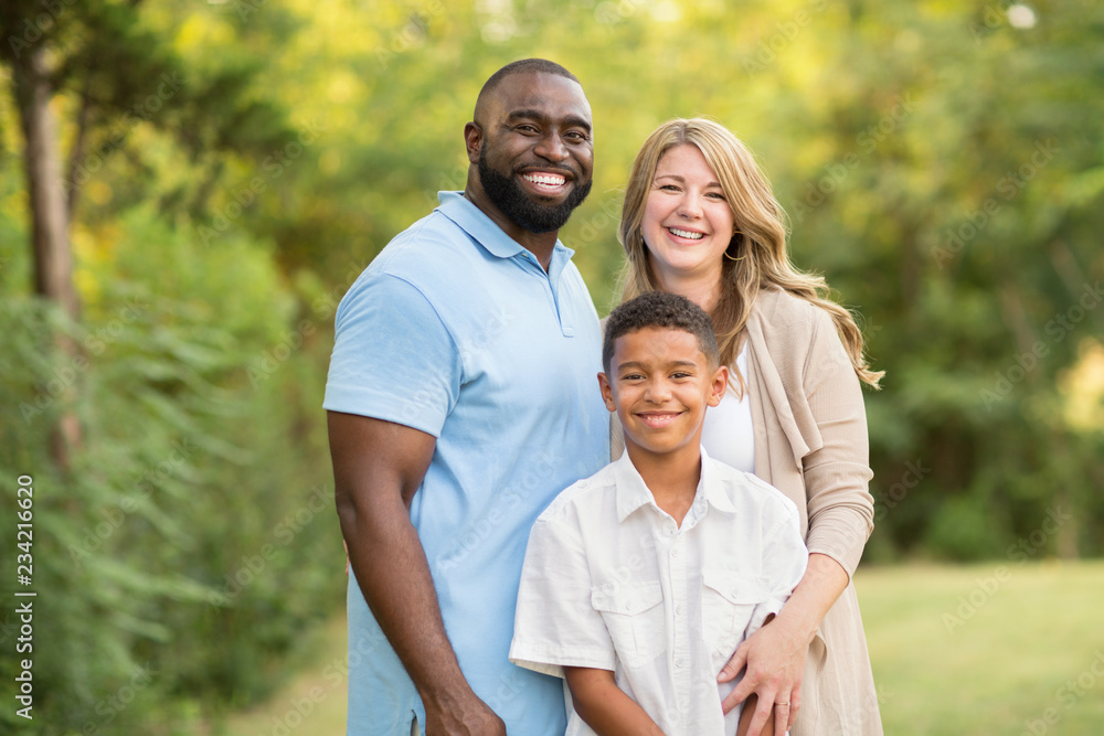 Obraz premium Portrait of a multi ethnic family laughing.