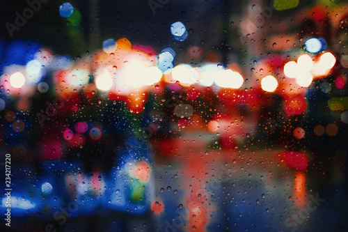 Drop on window car with the rainy night city