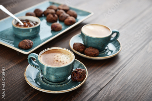 Two cup of coffee and with chocolate cookies