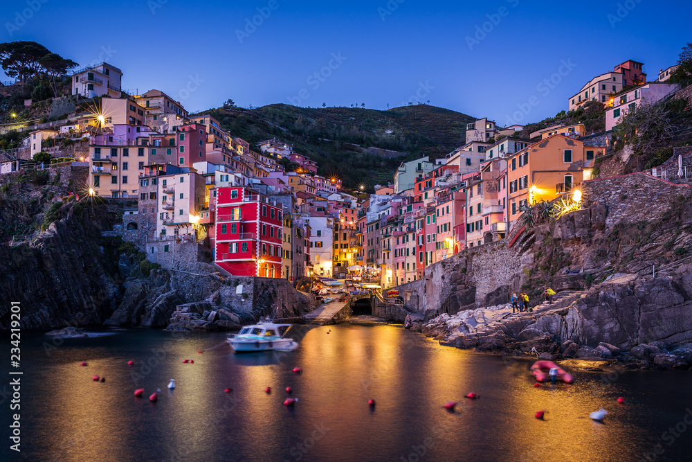 Night view of Riomaggiore. It is the most southern village of the five Cinque Terre towns. Liguria, Italy.